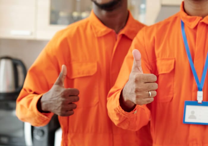 Maintenance workers thumbs up